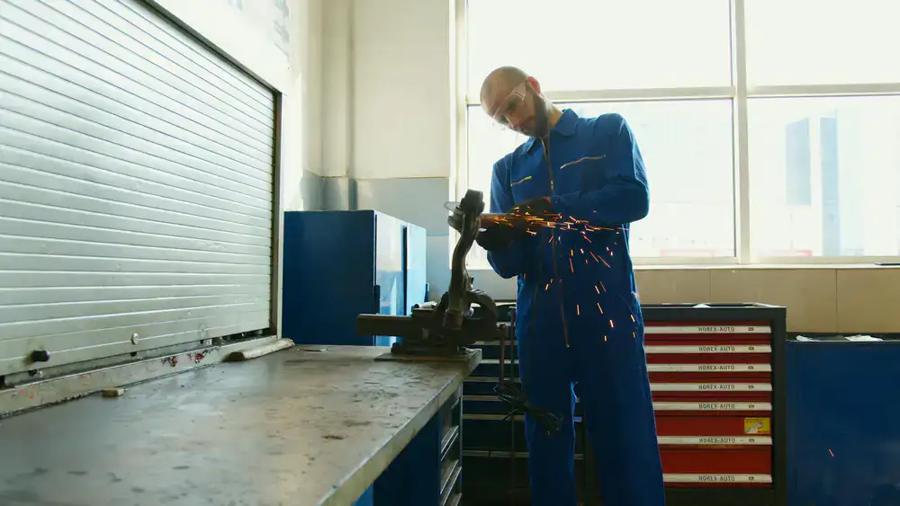 Technician using a HEPA vacuum on a dusty construction surface