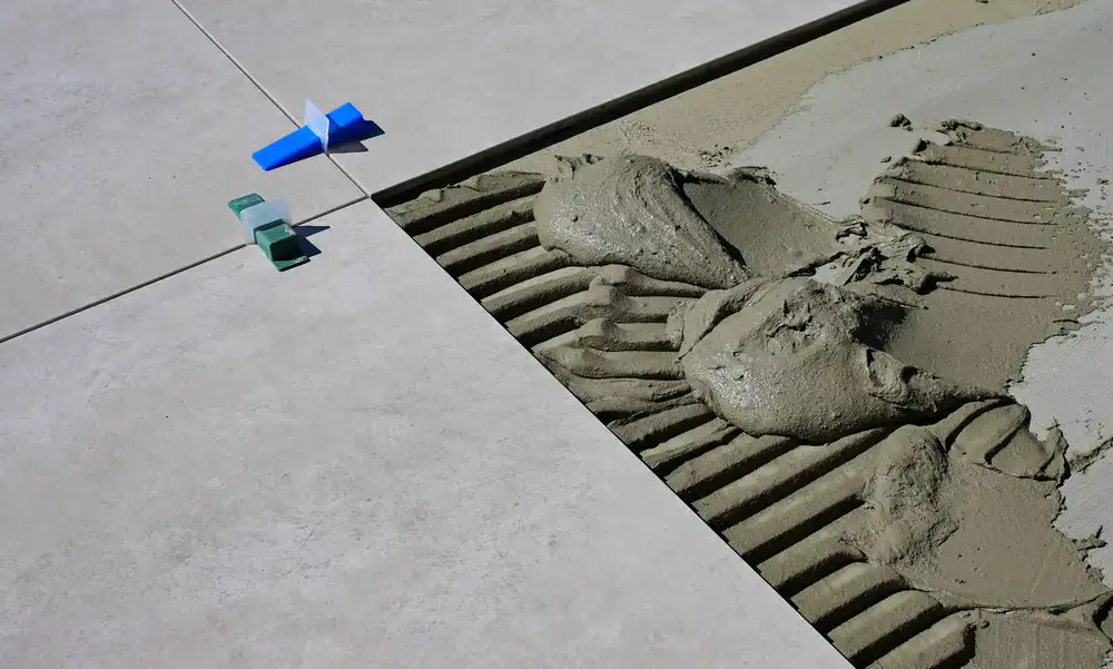Close up of a buffer cleaning a newly installed tile floor